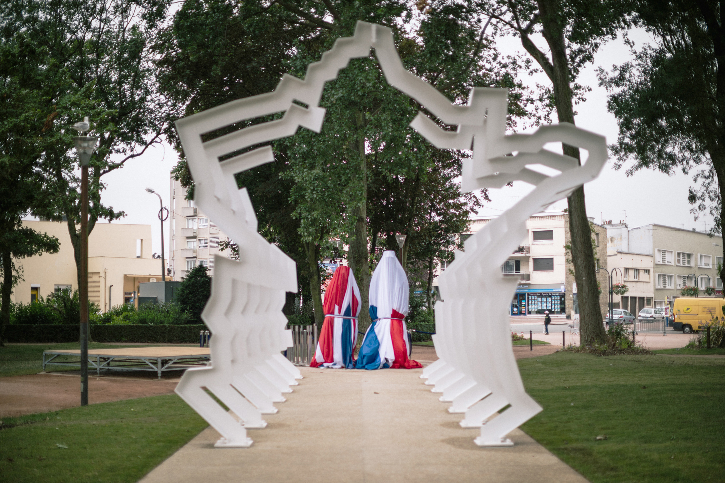 Statues of Winston Churchill and Charles de Gaulle shrouded in the Union Jack and Tricolour flags in Parc Richelieu in the centre of Calais, France Photograph: Rob Pinney for Point.51