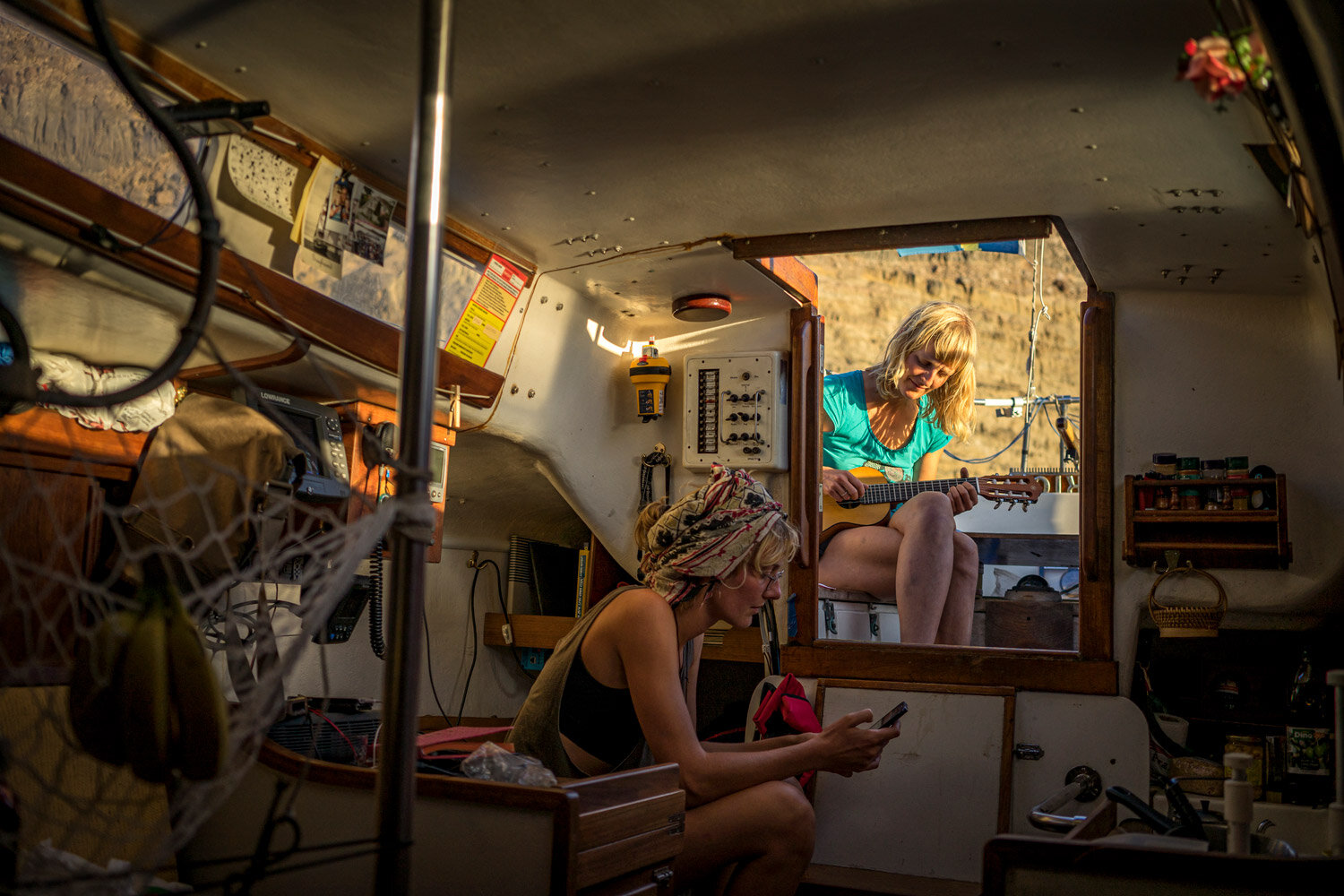 Emma playing one of her ukaleles while Caprice was anchored in Las Palmas. Two sisters from Germany lived on the boat with her during the time she spent in the Canary Islands. Photo: Lisa Hermes