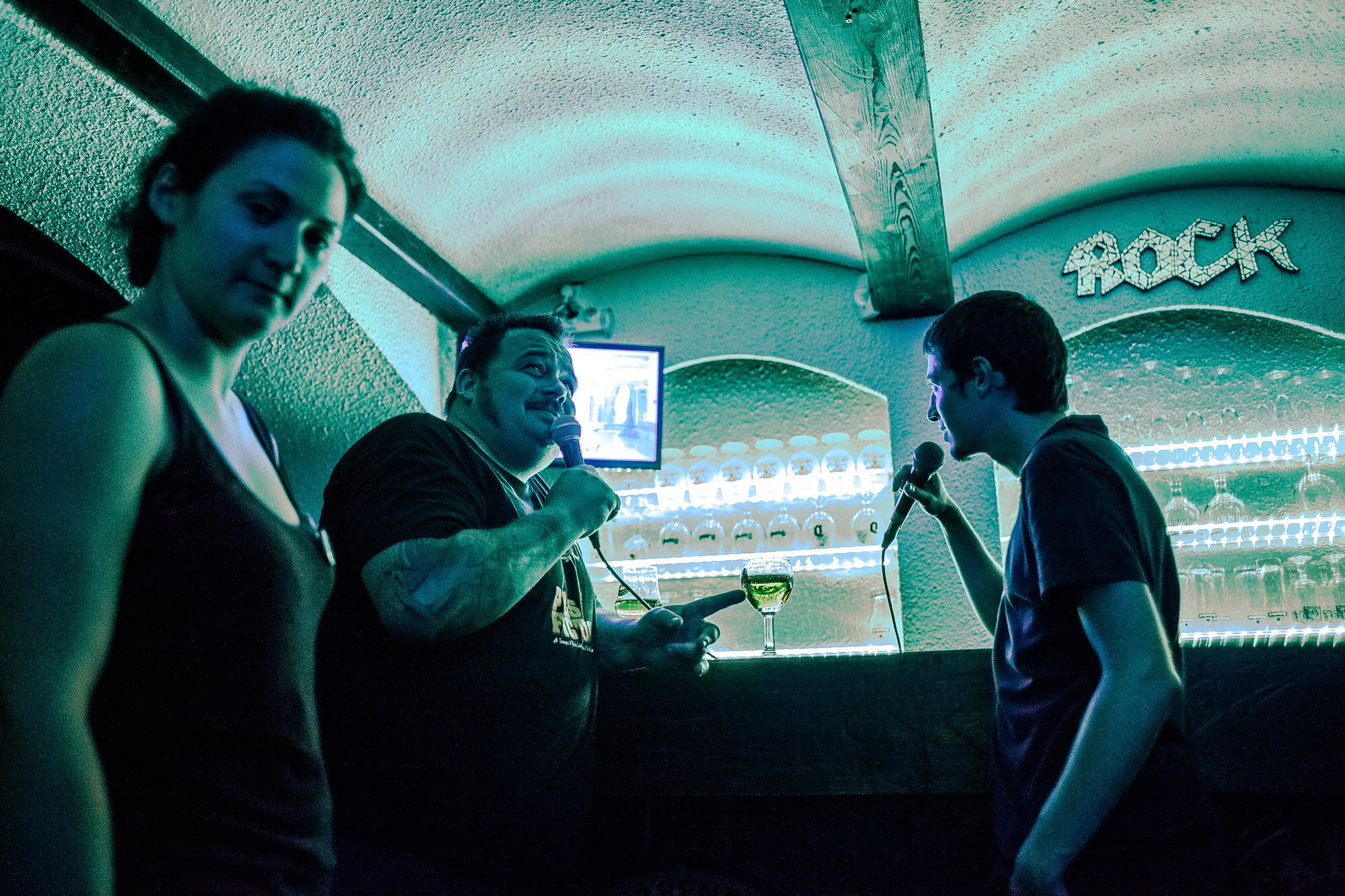 Patrons singing at the K-Vo, a small late-night karakoke bar on one of the city's side streets Photo: Julia Druelle for Point.51