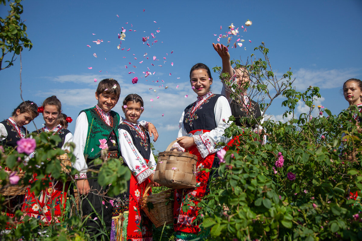Young Bulgarians dressed in folk costumes celebrate the rose harvest as part of the “rose picking ritual”.